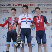 Ineos Grenadiers' Joshua Tarling (centre), Bahrain Victorious' Fred Wright (left), and Ineos Grenadiers' Connor Swift celebrate
