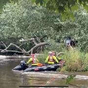 The fire crew as they rescued the two men from the island in the centre of the River Teifi