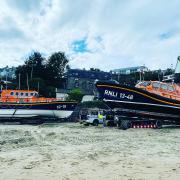 New Quay RNLI's Mersey class lifeboat (left) with the new Shannon class lifeboat (right) on New Quay beach