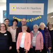 Michael and Sally Charlton (centre) celebrating 40 years in business with staff past and present.