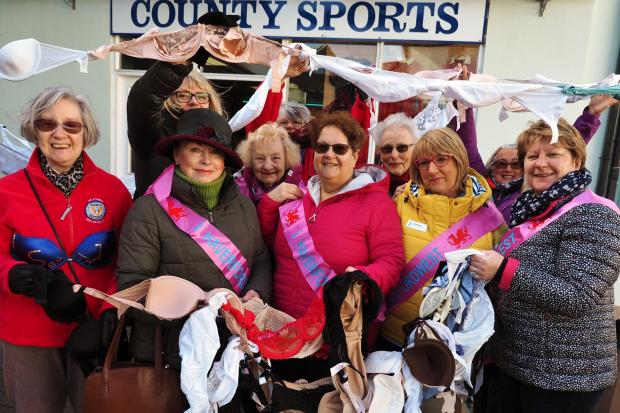 Members of Soroptimists International Haverfordwest and supporters hold their 'bra chain' aloft. PICTURE: Western Telegraph